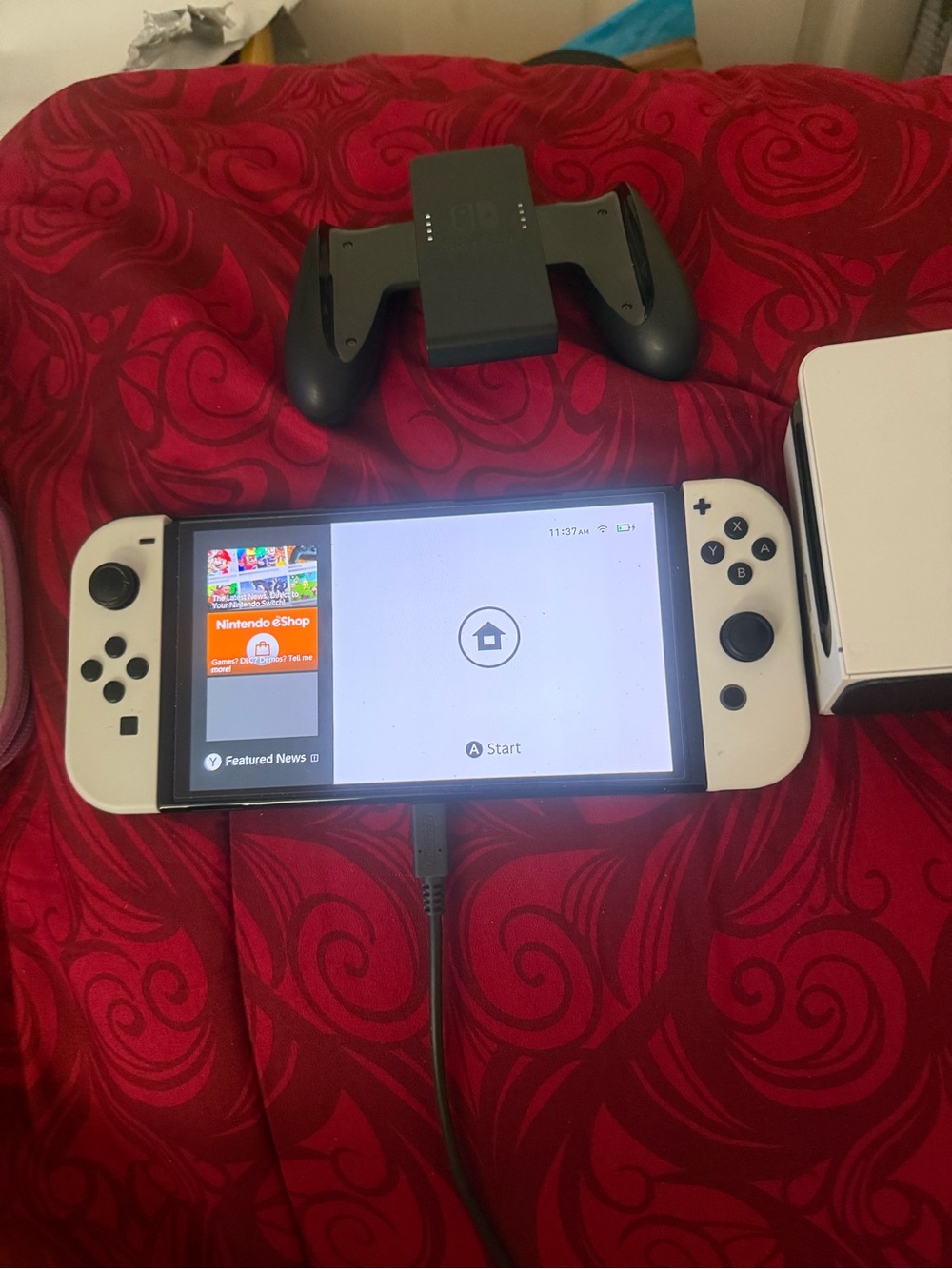 Nintendo Switch OLED Console with White Joy-Con and Black Grip